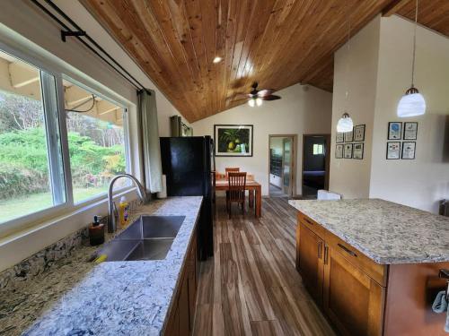 a kitchen with a sink and a counter top at Family Friendly Oasis- Firepit-Puzzles-Breakfast in Mountain View