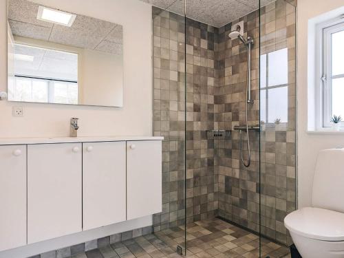 a bathroom with a shower and a toilet at 8 person holiday home in Læsø in Læsø