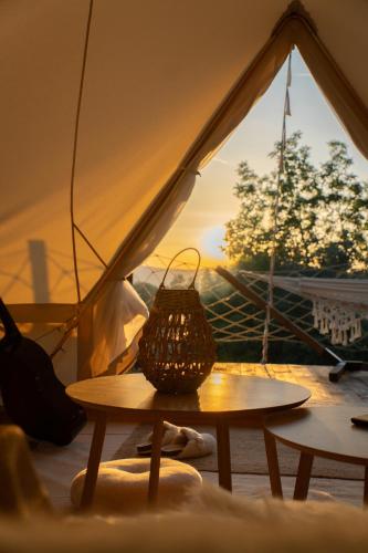 a basket sitting on a table in a tent at Glamping Ty Západy in Stanový