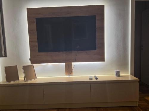 a flat screen tv sitting on top of a table at Apartman BIANKA in Bijeljina