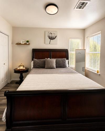 a bedroom with a large bed in a room at Casa Blanca Luxury Spa Suite with fireplace, Disc Golf, 5 beds in Tulsa
