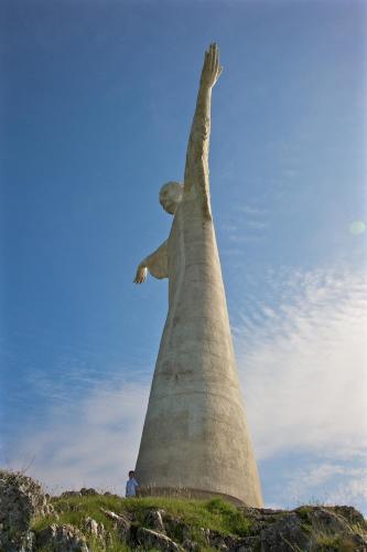 a statue of christ the redeemer on top of a hill at Romantic Hotel & Restaurant Villa Cheta Elite in Maratea