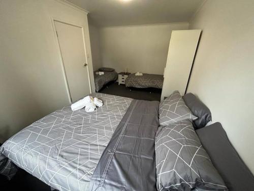 a bedroom with a large bed in a room at Comara Jindabyne Unit 1 in Jindabyne