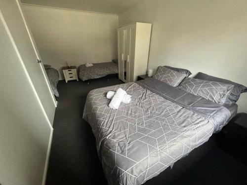 a bedroom with a bed with a towel on it at Comara Jindabyne Unit 1 in Jindabyne