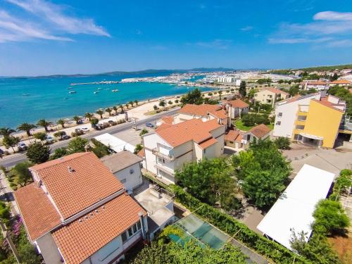 an aerial view of a town next to the ocean at Hotel Joso in Sukošan
