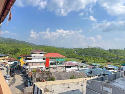 a view of a town from a building at Instahomestay in Vālpārai
