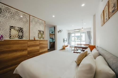 a bedroom with a large bed and a couch at BOHO Homestay No10 Alley 08 Ton That Thiep - Hanoi in Hanoi