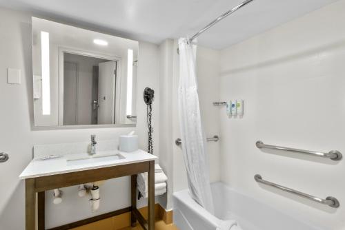 a bathroom with a sink and a shower at Comfort Inn Douglasville - Atlanta West in Douglasville