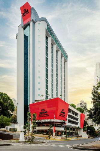 a large white building with a red roof at Marriott Executive Apartments Panama City, Finisterre in Panama City