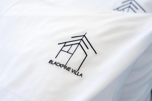 a drawing of a building on a white plate at BlackPine Villa in Amisianá