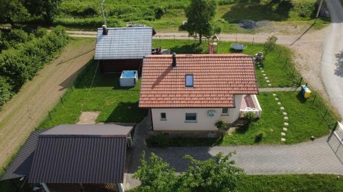 an overhead view of a small house with a red roof at Kuća za odmor Brlog in Otočac