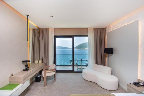 a hotel room with a view of the ocean at Ollie's by the sea in Donja Lastva