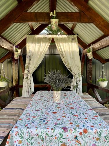 a large bed in a room with a canopy at У Лариси in Solochyn