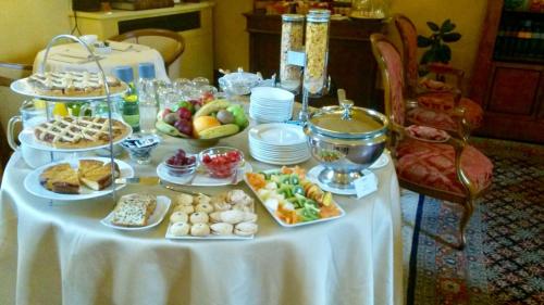a table with a buffet of food on it at La Locanda Di San Francesco in Montepulciano