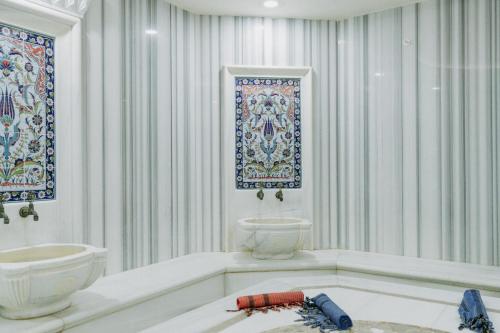 a bathroom with a toilet and a sink at Dragut Point South Hotel-All Inclusive in Turgutreis
