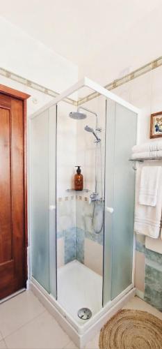 a shower with a glass door in a bathroom at Tra Terra e Laguna in Venice