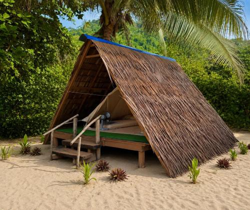 a small tent on the beach in the sand at Long Beach Camp in Perhentian Islands