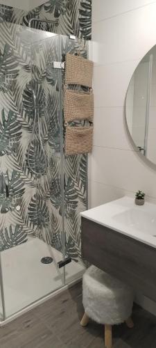 a bathroom with a glass shower and a sink at Villa Ulika in Fažana