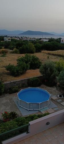 a swimming pool on the roof of a house at The house of joy in Egina
