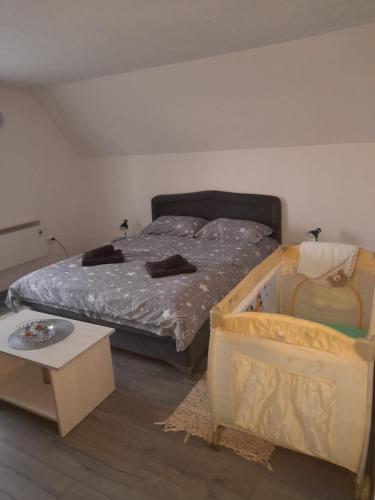 a bedroom with a bed and a nightstand next to it at Vikendica Miličin Konak in Vrdnik