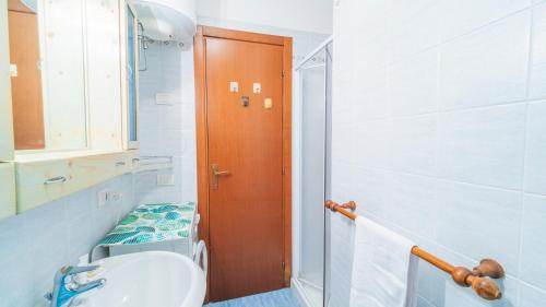 a bathroom with a toilet and a sink at Appartamento Vista Nel Mare Blu in Rio nellʼElba