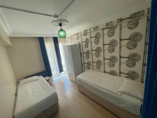 a bedroom with a bed and a green light at Poli House in Kasaplar