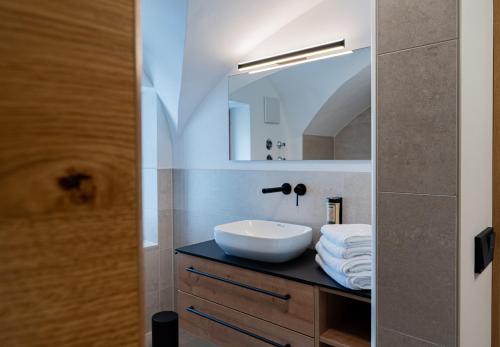 a bathroom with a sink and a mirror at N47 Apartments Berchtesgaden in Berchtesgaden