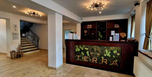 aoyer of a store with a counter and a staircase at TERRA penzión in Jasová