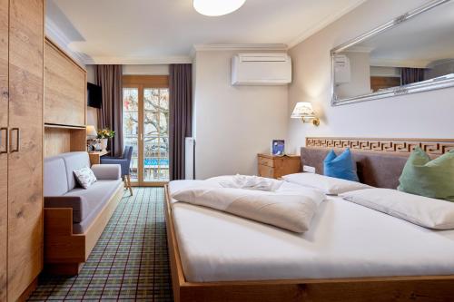 Voodi või voodid majutusasutuse Fish'Inn Zell - Hotel Fischerwirt toas