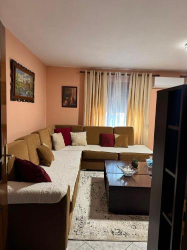 a living room with a couch and a table at Flat in Leskovik in Leskovik