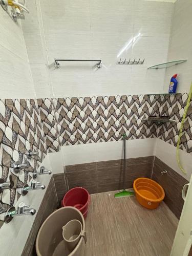 a bathroom with a sink and a toilet at RAMRAJ GUEST House in Ayodhya