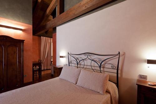 Postel nebo postele na pokoji v ubytování Relais Casa Orter