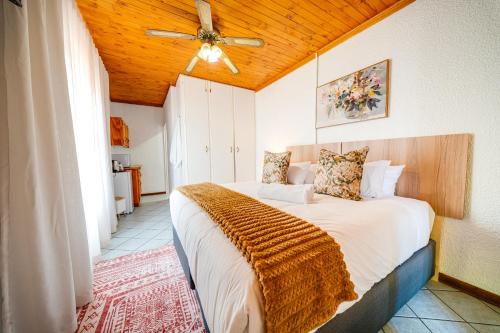 a bedroom with a bed with a wooden ceiling at 3 Italeni in Secunda