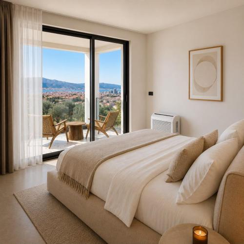 a bedroom with a large bed and a large window at White Hills Villa in Zadar