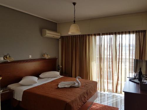 Postel nebo postele na pokoji v ubytování Apollo Hotel