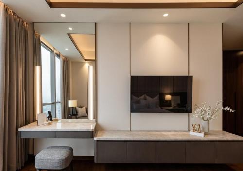 a bathroom with a sink and a mirror at Hotel Fairmounts Plaza Near IGI International Airport Delhi in New Delhi
