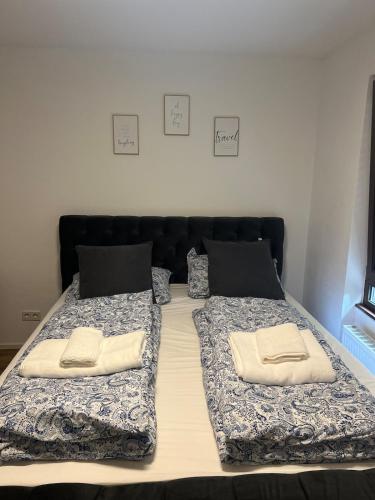two beds with pillows on them in a bedroom at A&A Mosel in Bernkastel-Kues