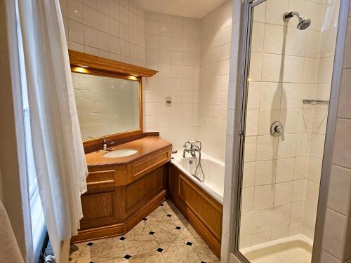 a bathroom with a sink and a shower at The Crown Hotel in Stone