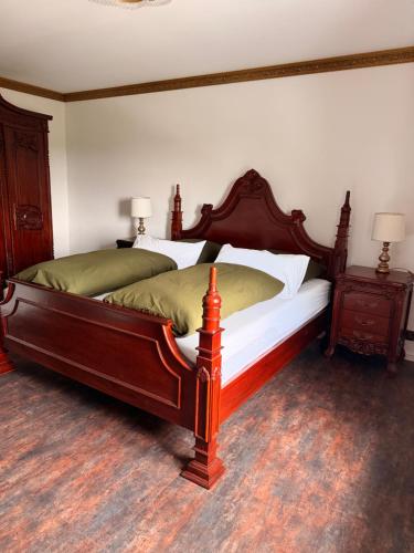 a bedroom with a large bed and two night stands at Theresiengarten in Bad Wörishofen