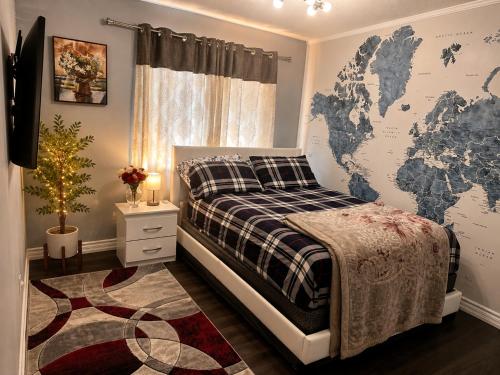 a bedroom with a bed with a map on the wall at Cozy Beautiful Home in Brampton