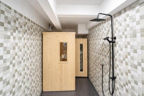 a bathroom with two wooden stalls and a shower at Buakhao Villa Pattaya Center 5 bedroom in Pattaya