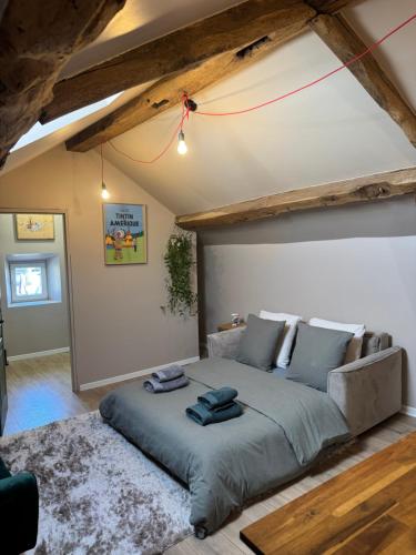 a bedroom with a large bed in a room at Belgica-Melay 52400 in Melay