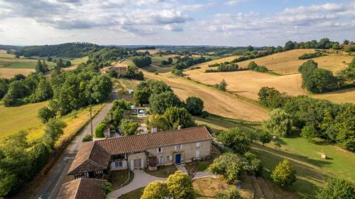 an aerial view of a house in a field at La Bastide de Sherlock in Troncens
