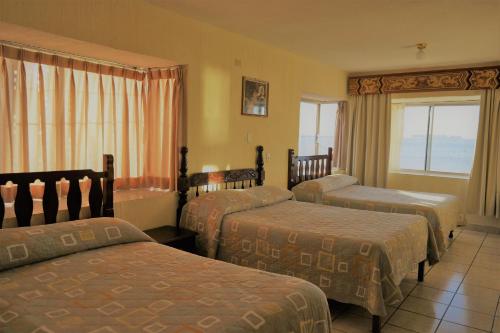 Katil atau katil-katil dalam bilik di Hotel Pekin
