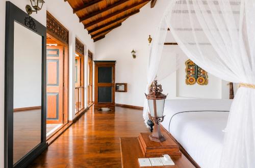 a bedroom with a bed and a window at Waterland in Negombo
