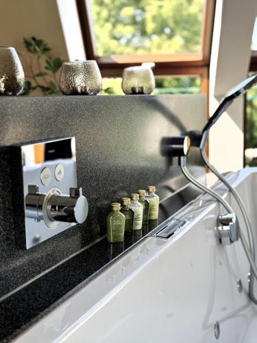 a kitchen with a counter with bottles on it at Hotel & Restaurant Waldblick in Pulsnitz
