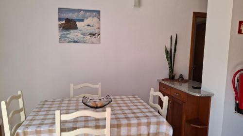 a dining room table with a checkered table and chairs at Aljezur Coast Apartment - Villa Luar in Aljezur
