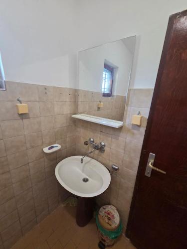 a bathroom with a sink and a mirror at Maki 4 in Radanovići