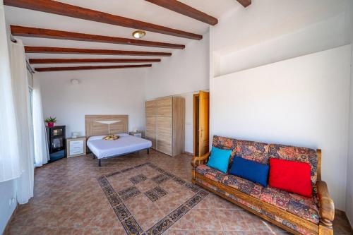 a living room with a couch and a bed at Villa Panoramic in Santa Susanna