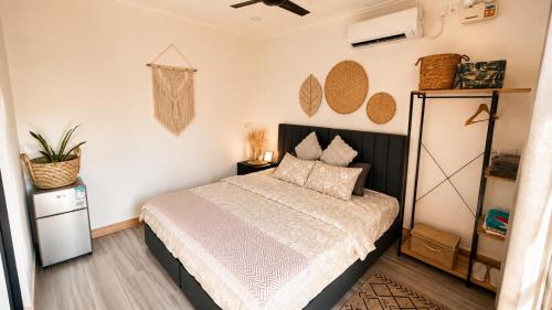 a bedroom with a bed in a room at Grande Maldives Inn in Himmafushi